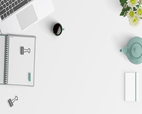 relaxed woman taking a break from laptop looking out the window